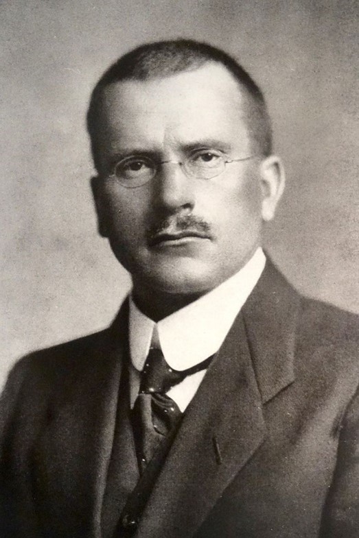 A black and white head shot of Carl Jung