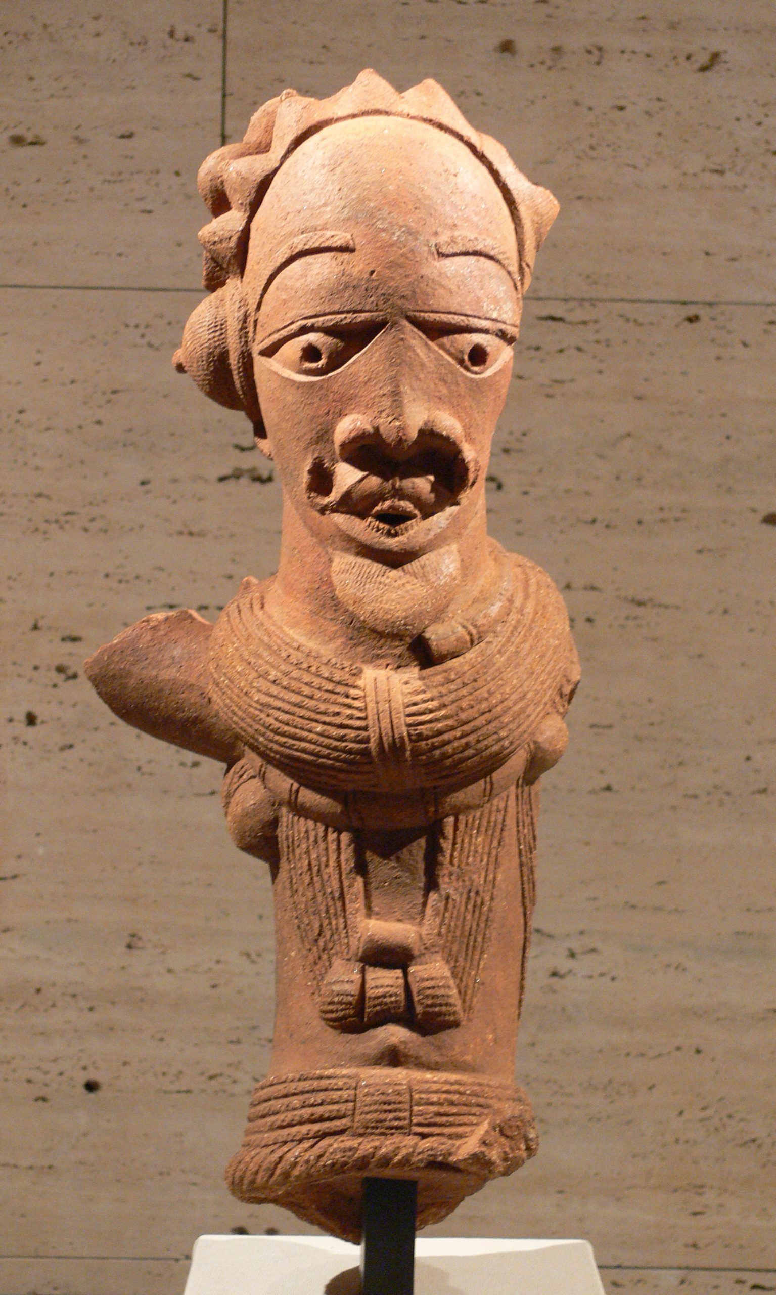 a terracotta bust of a man