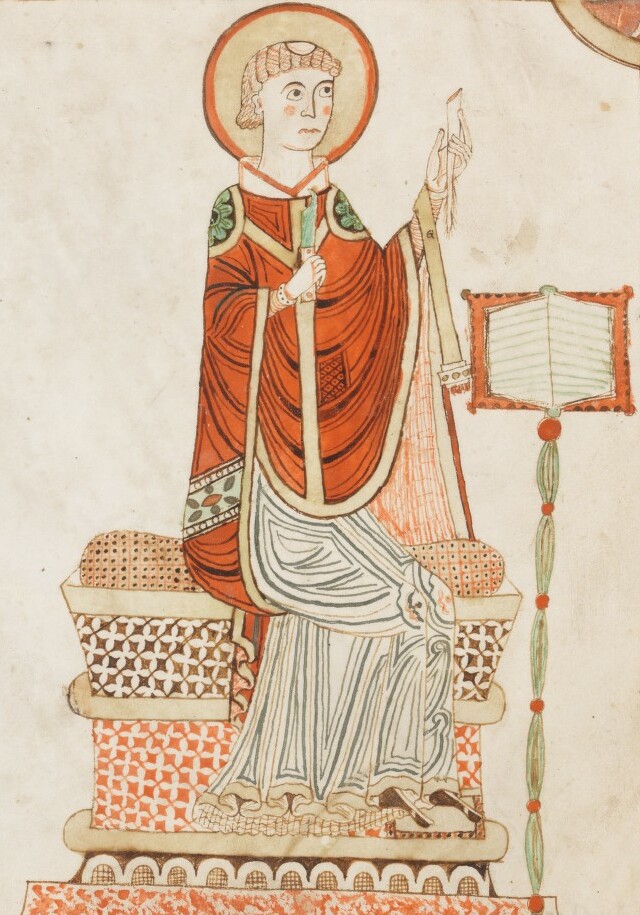 image from a manuscript depicting a man writing. A halo on his head indicates he is a saint.