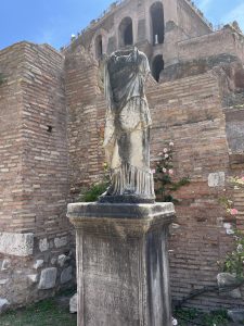 a headless marble statue of a Vestal Virgin in the Roman forum