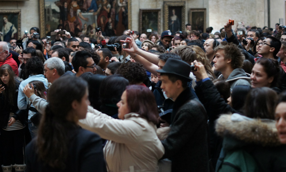 People taking photos of the Mona Lisa